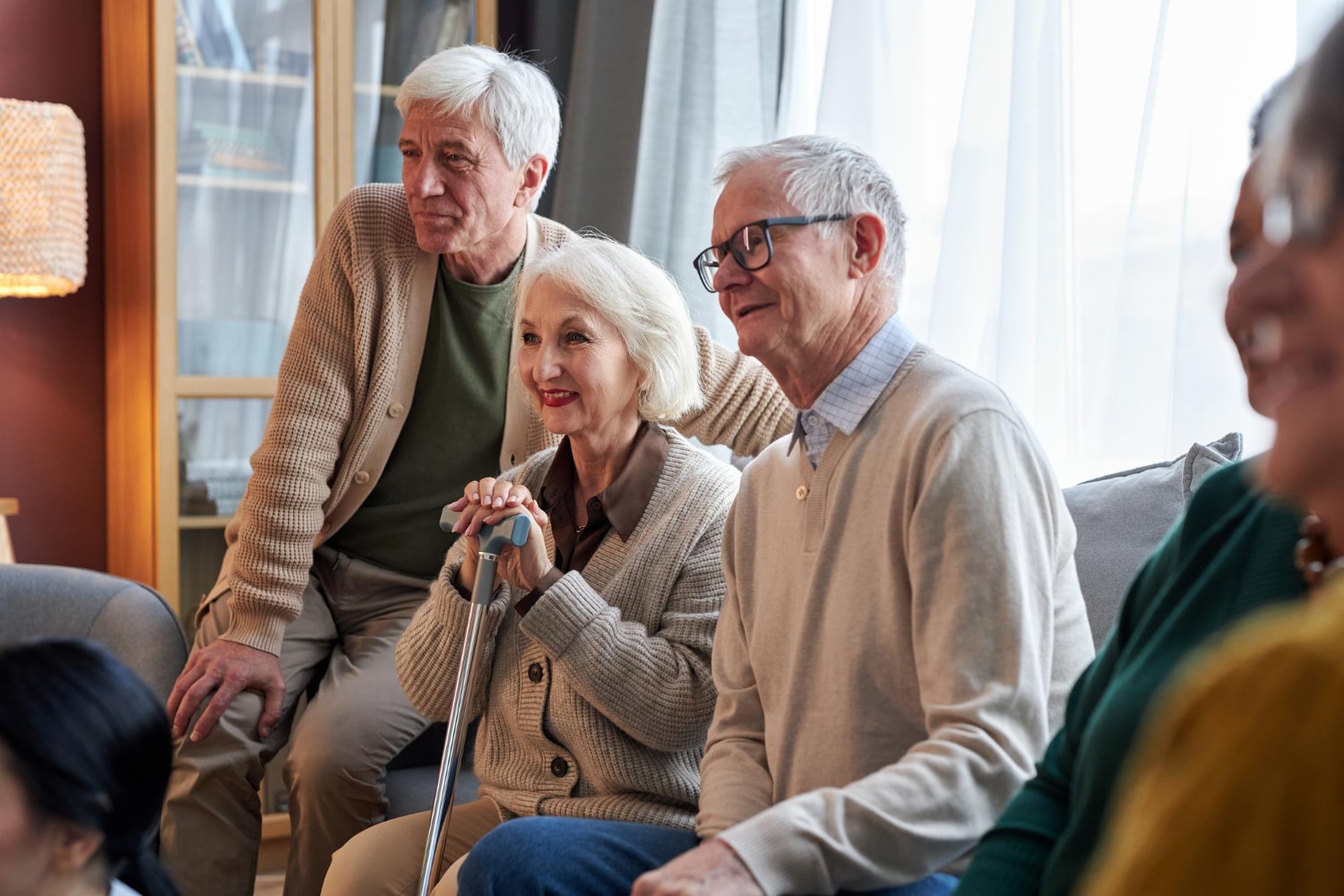 Hospice Brazos Valley - Who We Are Elderly people sitting together indoors.